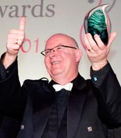 Clark Denmark collects his 2011 Joseph Maitland Robinson Award for Outstanding Contribution.