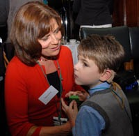 Actress Rebecca Front with seven-year-old Sam Cowell, who was born deafblind.