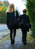Kieran, pictured with sister Lauren, missed eight months of school due to cancer treatment.