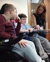 Takin' Charge Manager Dr Janet Hoskin with young people with Duchenne.