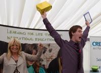 A 2012 winner, Luke Tuckwell, receives his award from Gaby Roslin.
